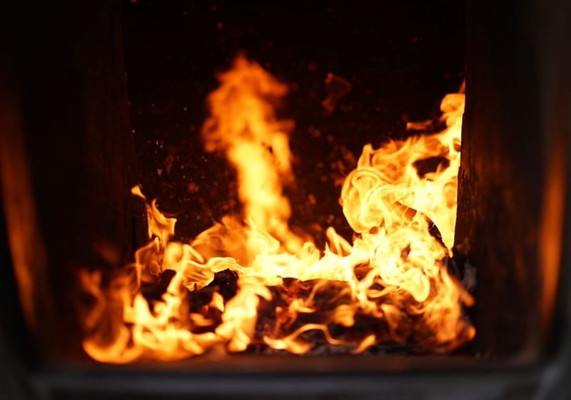 Furnace burner flames during a heating repair for a Tampa, FL home
